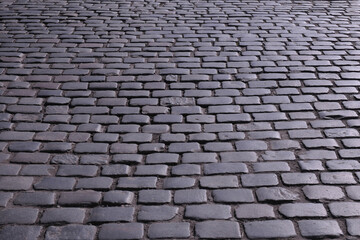 Old stone pavements in the streets of European cities ...