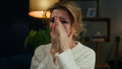 Crying woman shouting, portrait of screaming female person in living room, feeling anger and stress, bad mood. Family problems, aggressive emotional wife quarreling. 
