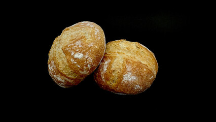 Bread and rolls isolated on black background