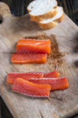 red salted salmon fish meat on a chopping board