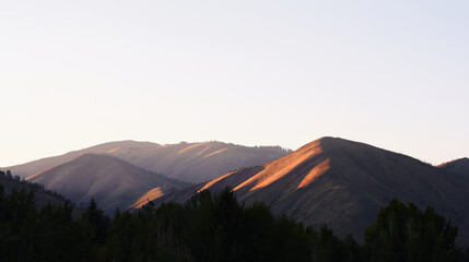 Sunset light shining on soft Idaho mountains © Dave