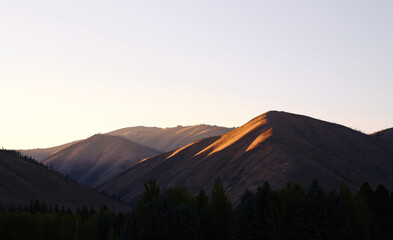 Sunset light shining on mountains in Sunny Valley, Idaho