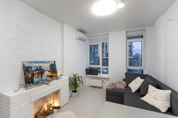 Bright living room interior with fireplace