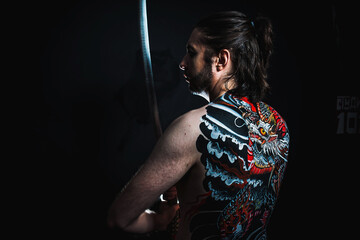 yakuza with dragon tattoo on back