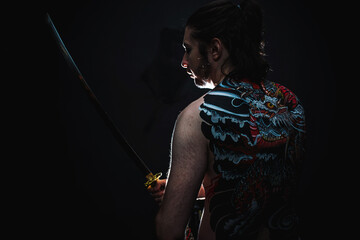 yakuza with dragon tattoo on back