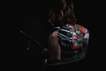 yakuza with dragon tattoo on back