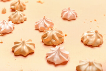 Delicious meringue on color background, closeup