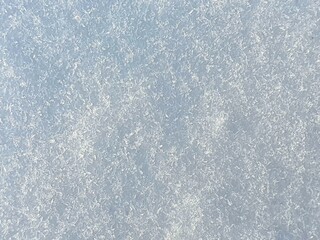 Snow background close-up. Winter landscape. It's snowing outside. Snowflakes, snowdrifts. At close range. Snowfall. Nature. Space for recording, free space. Background.