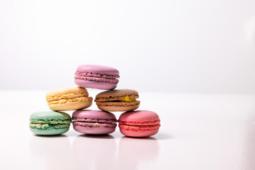 Obraz na płótnie Canvas Macaroons on white background, colorful french cookies macaroons isolated copy space. Macaroons