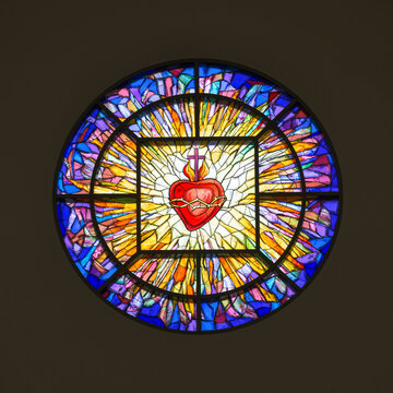 Sacred Heart of Jesus round stained glass window inside the Co-Cathedral of the Sacred Heart Catholic church in downtown Houston, Texas
