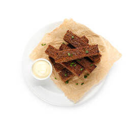 Plate with tasty croutons and sauce on white background