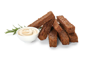 Tasty croutons and sauce on white background