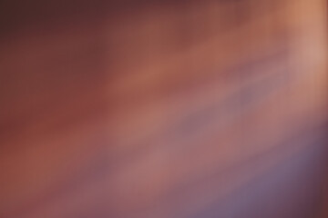 Abstract violet shadows on a wall from the window at sunset.