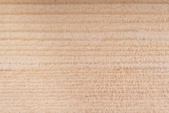 drewniane tło z jasnego drewna sosnowego o regularnych słojach