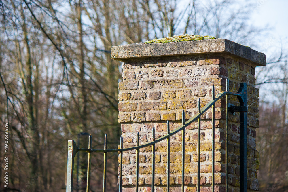 Poster Close-up shot of old steel gates in autumn