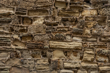 Fototapeta premium Background of honey coloured stone with holes