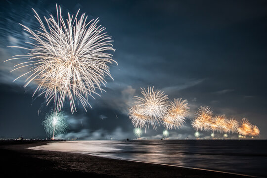 Scenic view of several fireworks on the beach in Cavallino-Treporti at night