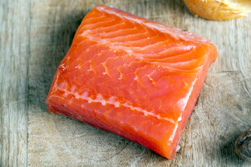 red salted salmon fish meat on a chopping board
