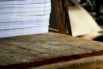 Printing factory scene with wooden pallet, stack of paper and wooden ladder