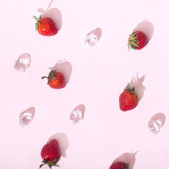  Strawberries and diamonds on a pastel pink background. Aesthetic retro fashion idea.