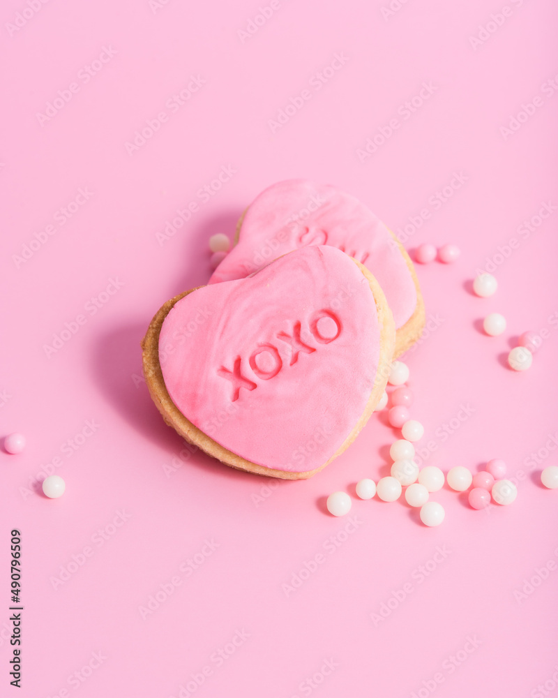 Sticker Closeup of heart-shaped Valentine's day cookies on a pink background