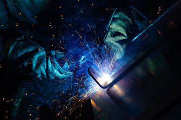 Arc welding of iron parts, close up view