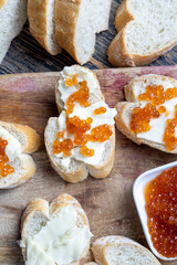 natural red salmon caviar with baguette and butter