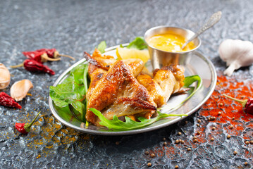 plate of chicken wings on a table