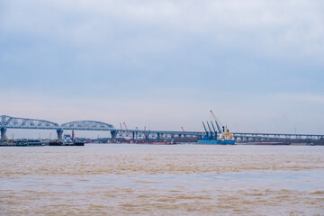 Ship and barge activity on the Mississippi River near the Huey P. Long Bridge