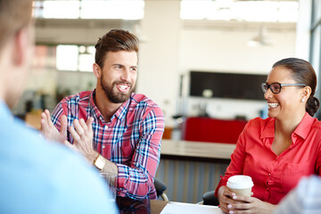 Hes absolutely brimming with ideas. Shot of a group of young designers in a meeting.