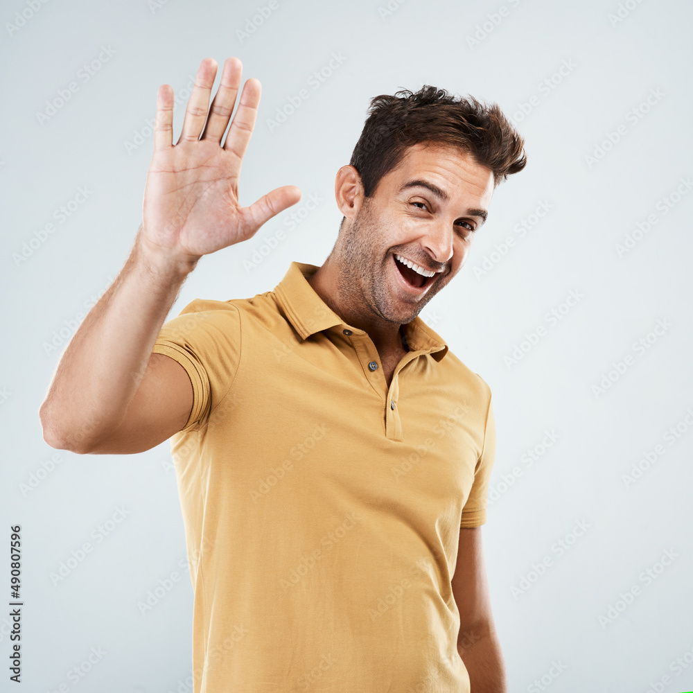 Poster are we going to do a high five. portrait of a cheerful young man smiling brightly with his one hand 
