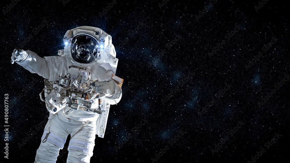 Wall mural astronaut spaceman do spacewalk while working for spaceflight mission at space station . astronaut w