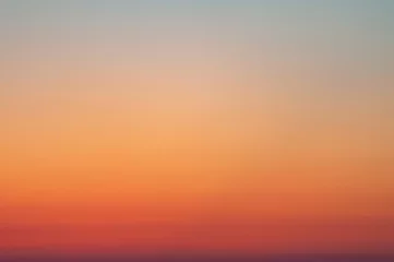 Poster Tranquil background of red and orange gradient sky © Cherrie Photography/Wirestock