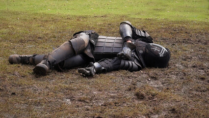 Medieval knight fallen in a battlefield