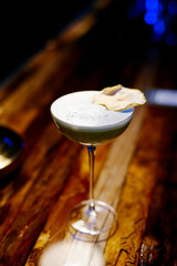 beautiful cocktail with dried fruit in a night bar