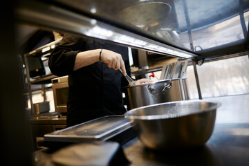 chef preparing dessert in the kitchen