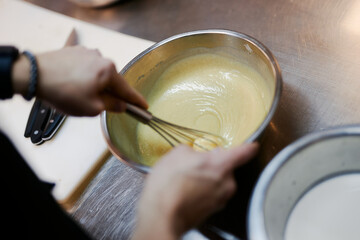 chef preparing dessert in the kitchen