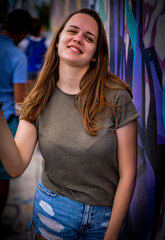 Street style photo shoot with a young pretty woman in the colorful streets of Miami