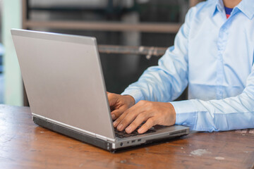 person typing on laptop