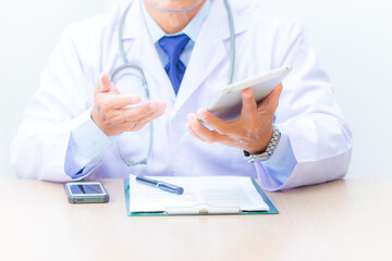 doctor with tablet computer