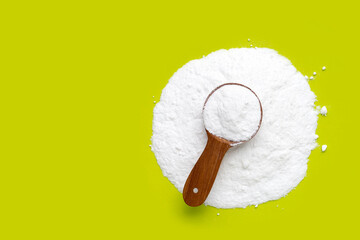 Baking soda on green background.