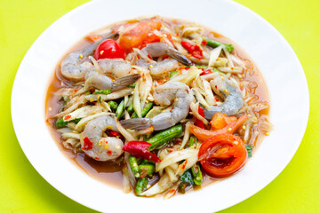 Papaya salad with shrimp in white plate