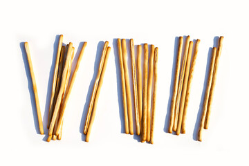 Crispy italian bread sticks on white