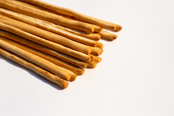 Crispy italian bread sticks on white