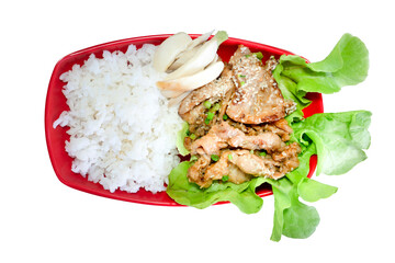 Grilled pork rice. Arrange on vegetables with red plate. On isolated white background with clipping path.