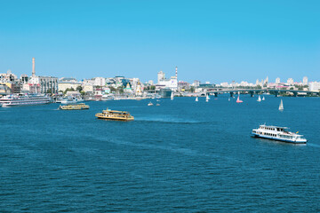 Landscapes of Kyiv, river station, pedestrian bridge, monument of The Motherland Calls, beautiful buildings and streets