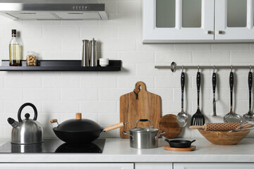 Countertop with different cooking utensils in kitchen