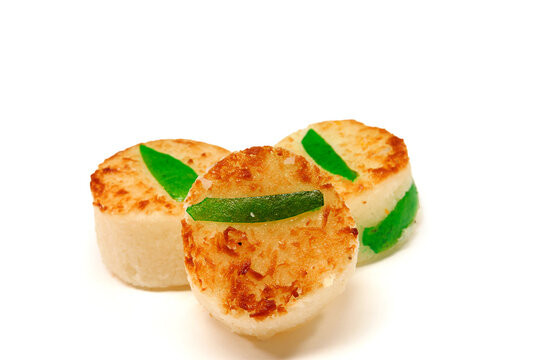 Mexican cocadas, cocadas with lemon peel, typical Mexican sweets, on white background with space for text