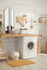 Obraz na płótnie Canvas Stylish bathroom interior with modern washing machine