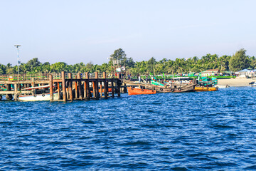 Fototapeta na wymiar Tourist jetty of St. Martin's Island, Bangladesh. Photo of a seaport on an island with many ships docked. Good to use for outdoor and something about facilities or transporter content.